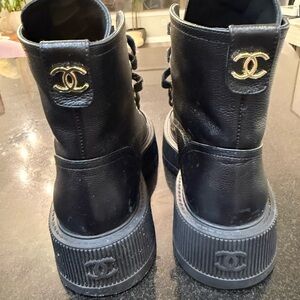 CHANEL Black Leather Lace-Up Boots with Gold Accents